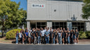 The Simax team outside the Simax Sports office